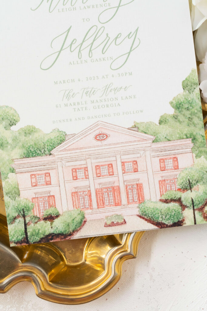 Formal custom wedding invitation featuring a watercolor venue illustration of the Tate House in North Georgia. Also includes calligraphy lettering.