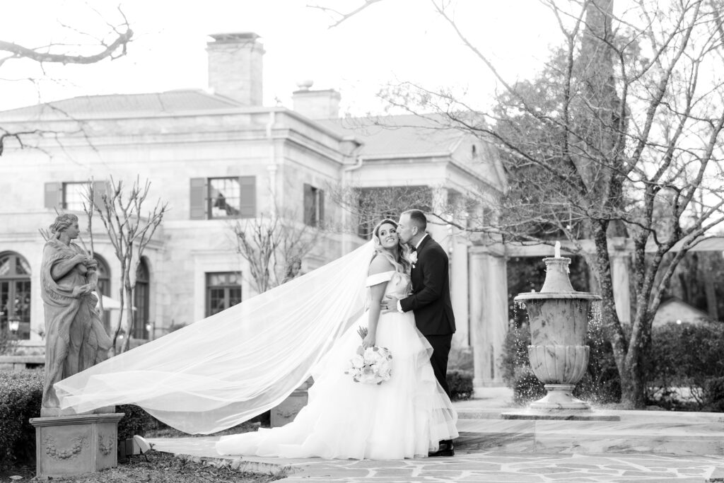 Elegant photo of bride and groom outside of the Tate House in North Georgia.