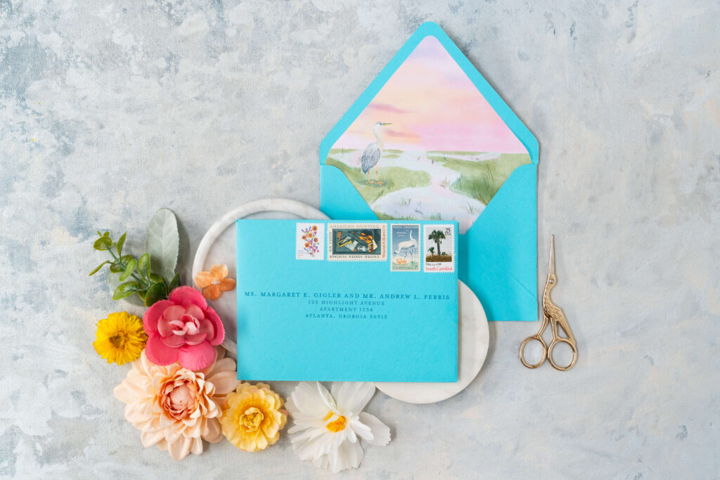 Wedding envelopes feature vintage postage and custom envelope liner for wedding envelopes.