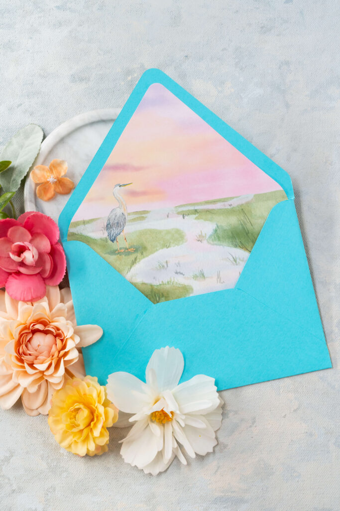 Envelope liner with a watercolor illustration of marshland and heron in Charleston, South Carolina.