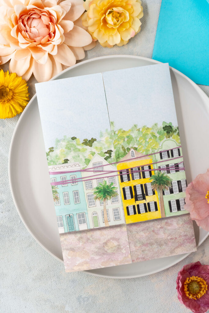 Gatefold card with whimsical watercolor illustration of Rainbow Row in Charleston, South Carolina.