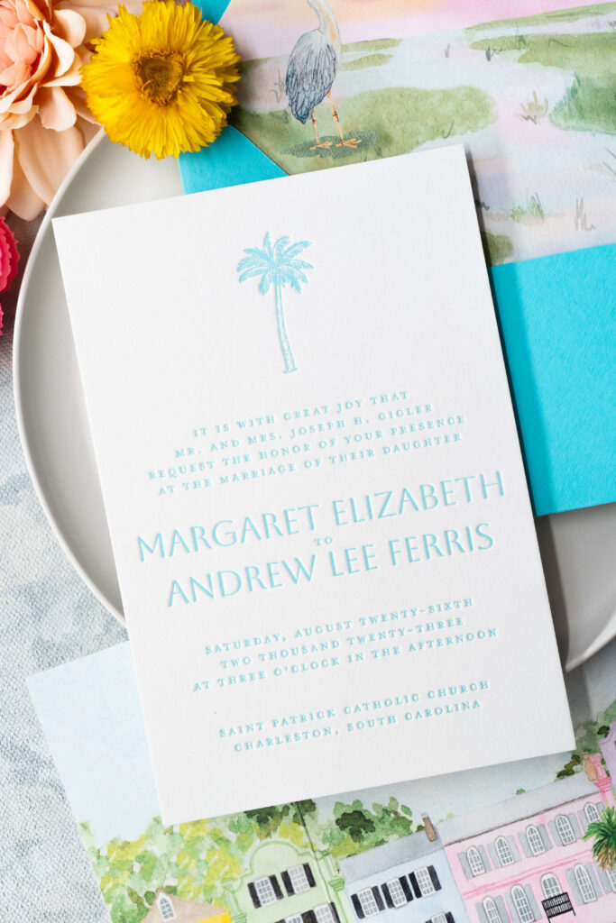 Letterpress formal wedding invitation with Rainbow Row gatefold card and turquoise custom envelopes and watercolor painted envelope liner.