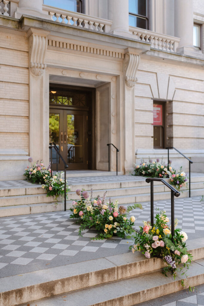 Entrance to the Gibbes Museum of Art in Charleston, South Carolina, staged for garden party wedding with beautiful florals.