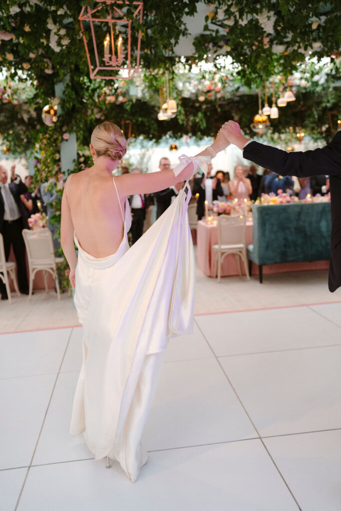 Bride and Groom at the Gibbes Museum of Art garden party wedding reception dancing together.