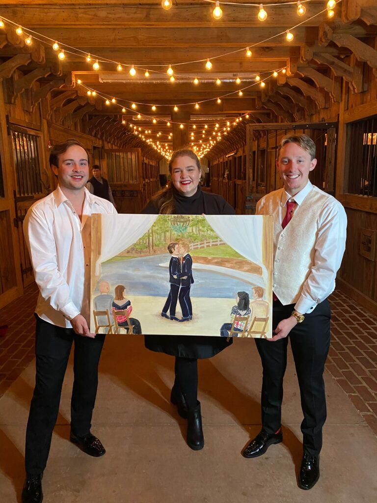 E Stokes Creations with grooms showing live wedding painting during the Farm in Rome GA wedding.